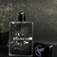 Perfume bottle labeled 'REGRETS' with a dark, textured background